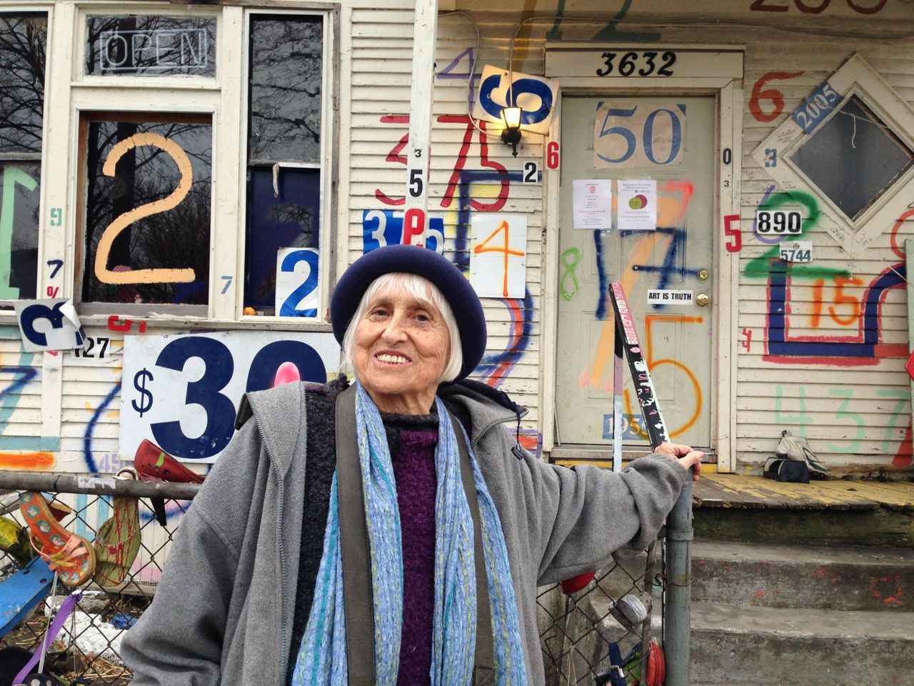 Harriet Berg in front of Detroit's Heidelberg Project